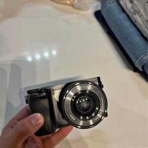 Sony a6000 used with lens and battery and cable charger,bag the price is firm